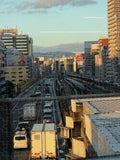 Urban Sunset Over Railway and Traffic - Puzzle